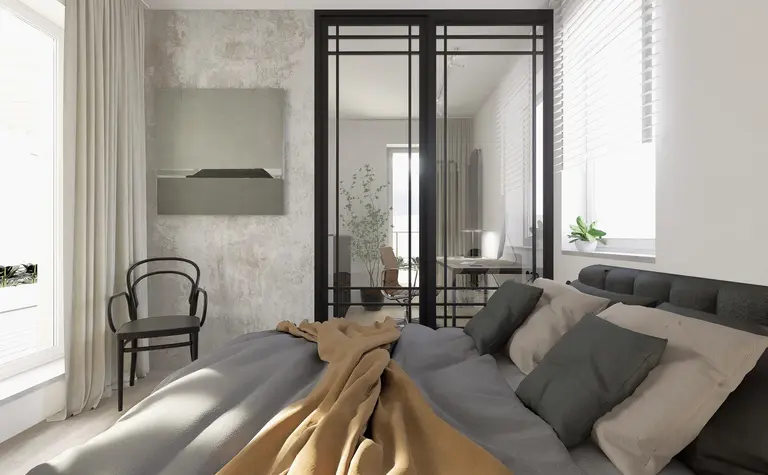 Sypialnia w stylu industrialnym z minimalistycznym łóżkiem i biurkiem.
