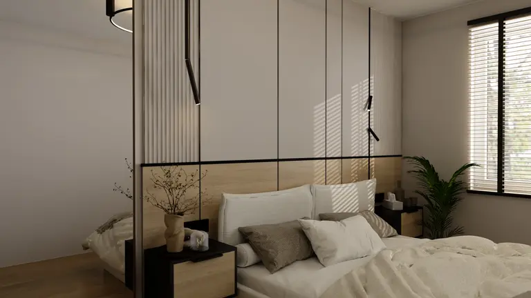 Sypialnia w stylu minimalistycznym z jasnymi ścianami i drewnianym łóżkiem.