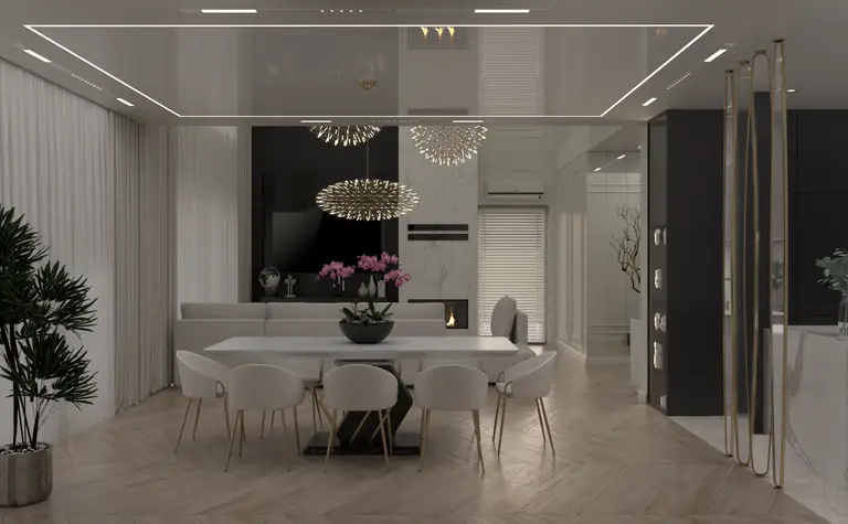 Wnętrze jadalni z białym stołem, eleganckimi krzesłami i nowoczesnymi lampami.