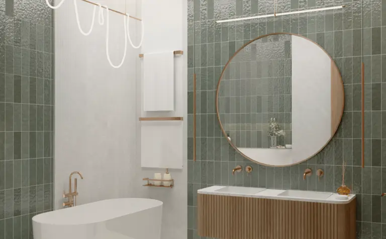 Nowoczesna łazienka z zielonymi płytkami, wanną i okrągłym lustrem w stylach art deco i vintage.