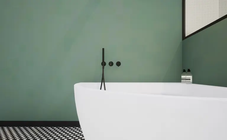Nowoczesna łazienka w stylu art deco i vintage z białą wanną i zielonymi ścianami.