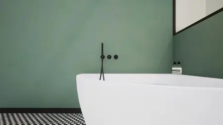 Nowoczesna łazienka w stylu art deco i vintage z białą wanną i zielonymi ścianami.