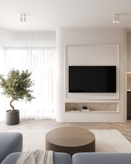 Wnętrze salonu z minimalistycznym wystrojem, telewizorem i roślinnością