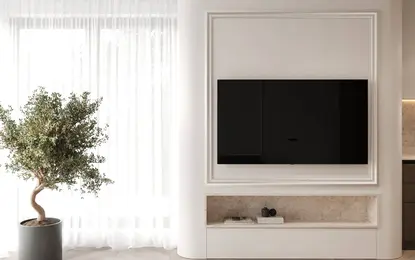 Wnętrze salonu z minimalistycznym wystrojem, telewizorem i roślinnością