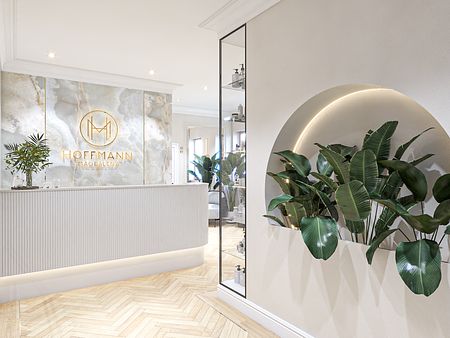 Recepcja z minimalistycznym wystrojem, roślinami i nowoczesnymi akcentami.