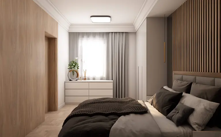 Wnętrze sypialni z nowoczesnym designem, drewnianą ścianą i białą komodą.