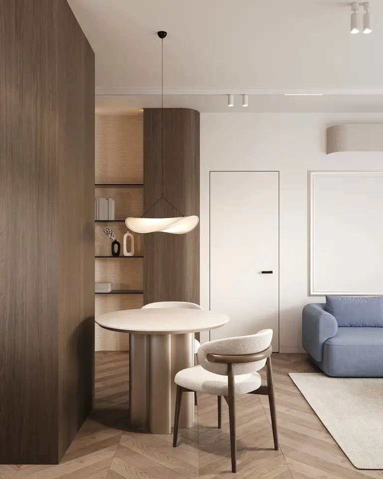 Minimalistyczne wnętrze z okrągłym stołem i jasną sofą, quiet luxury.