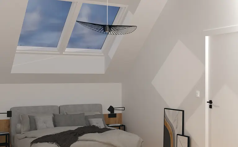 Sypialnia minimalistyczna z szarym łóżkiem i oknami dachowymi