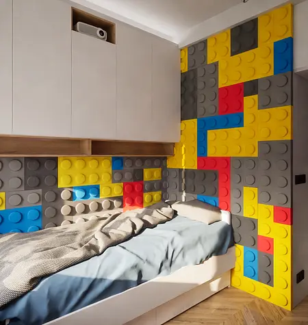 Pokój dziecięcy w stylu eklektycznym ze ścianą z klocków LEGO i łóżkiem.