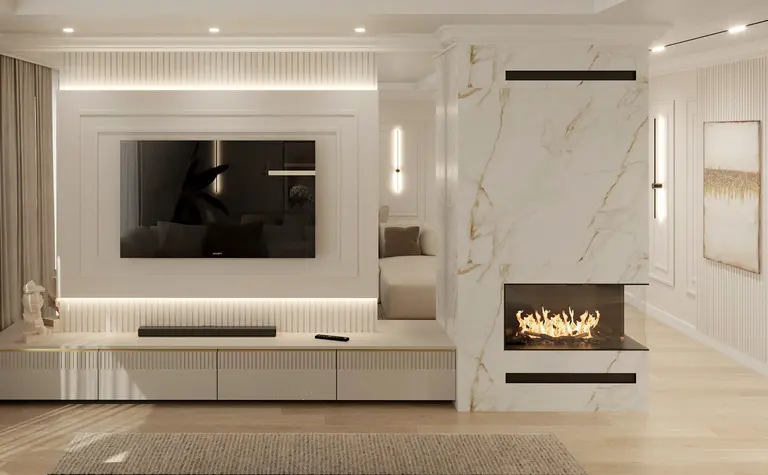 Wnętrze salonu z białymi meblami, kominkiem oraz elementami art deco i glamour.