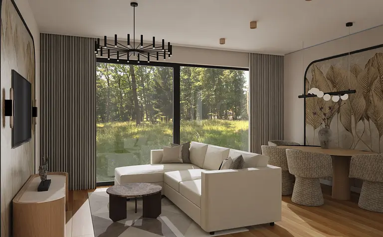 Wnętrze nowoczesnego salonu z białą sofą, drewnianym stołem oraz dużymi oknami.