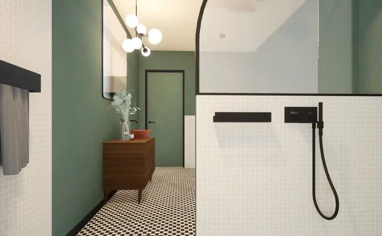 Łazienka w stylu art deco i vintage z zielonymi ścianami i czarnymi detalami.