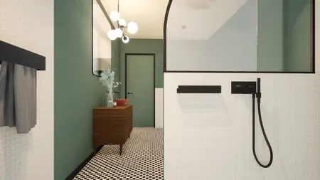 Łazienka w stylu art deco i vintage z zielonymi ścianami i czarnymi detalami.
