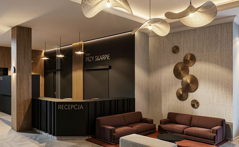 Recepcja hotelowa w stylu industrialnym i minimalistycznym z brązowymi meblami.