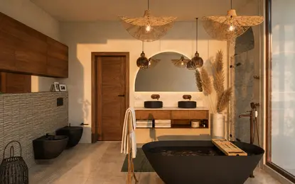 Wnętrze łazienki z boho i minimalistycznym stylem, czarna wanna, drewniane akcenty.