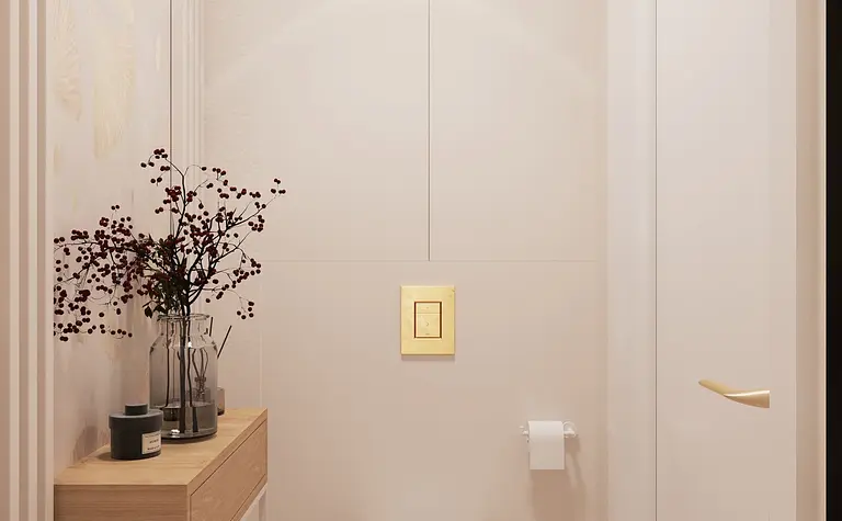 Minimalistyczna toaleta z jasnymi ścianami i drewnianymi akcentami.