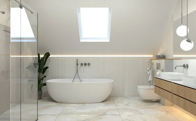 Wnętrze nowoczesnej łazienki z białą wanną i szarym wykończeniem.