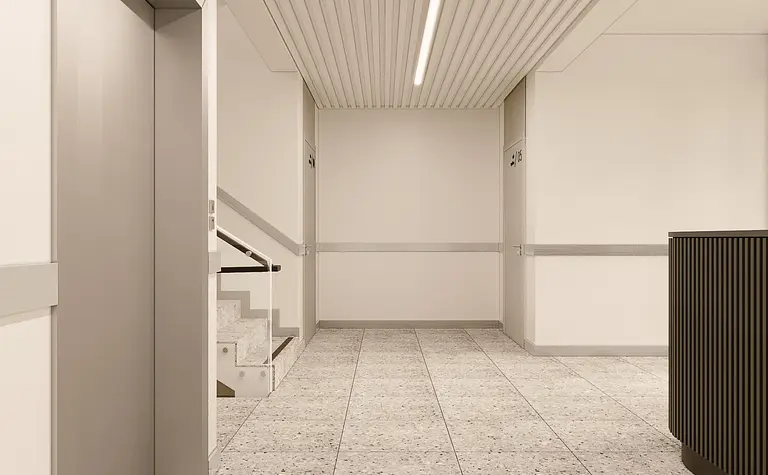 Korytarz z minimalistycznym wystrojem, nowoczesne ściany i podłoga w stylu soft minimalizm.