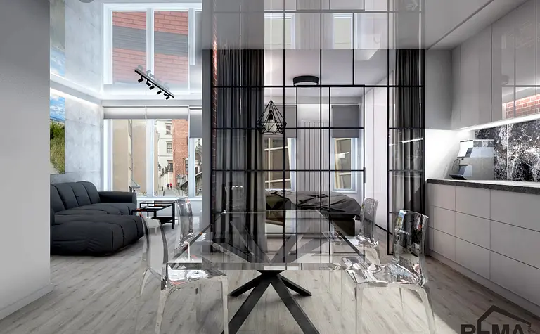 Wnętrze nowoczesne z industrialnymi akcentami, przezroczysty stół i czarna sofa.