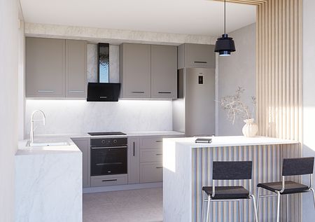 Kuchnia minimalistyczna z szarymi meblami i białym blatem.