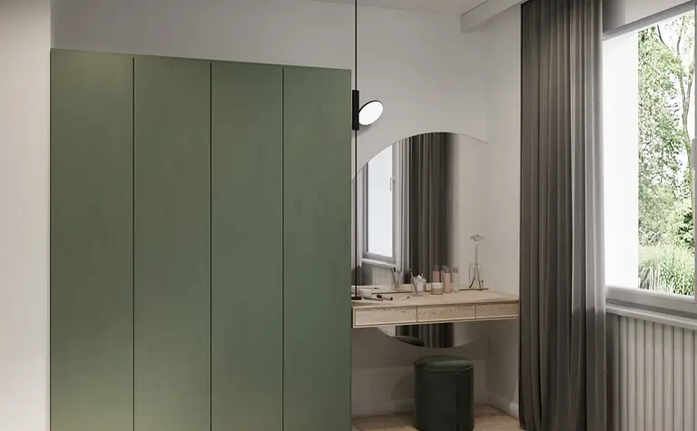 Eklektyczna sypialnia z minimalistycznymi meblami, zieloną szafą i nowoczesnym biurkiem.