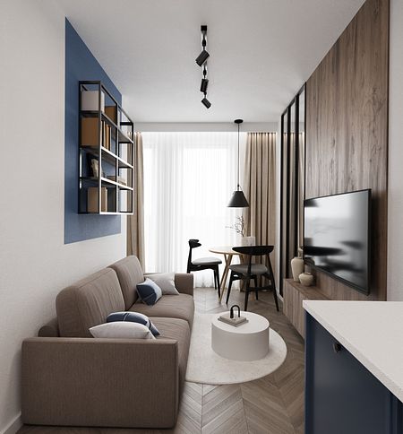 Wnętrze minimalistycznego salonu z brązową sofą i niebieskimi detalami.