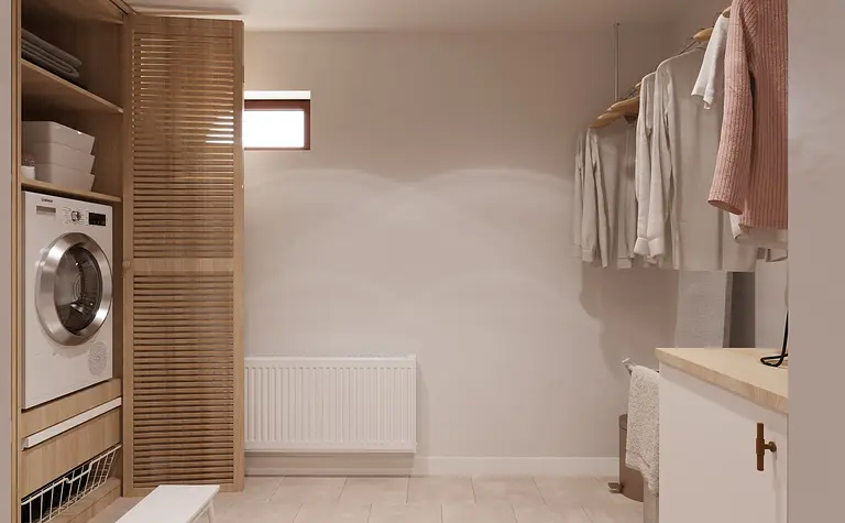 Pralnia w stylu minimalistycznym z drewnianymi meblami i pralką.