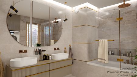 Wnętrze łazienki z białą umywalką, złotymi detalami i minimalistycznym designem.