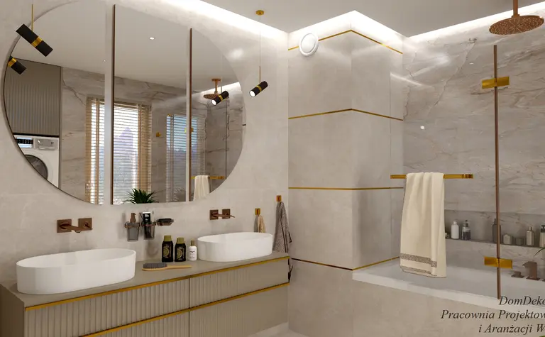 Wnętrze łazienki z białą umywalką, złotymi detalami i minimalistycznym designem.