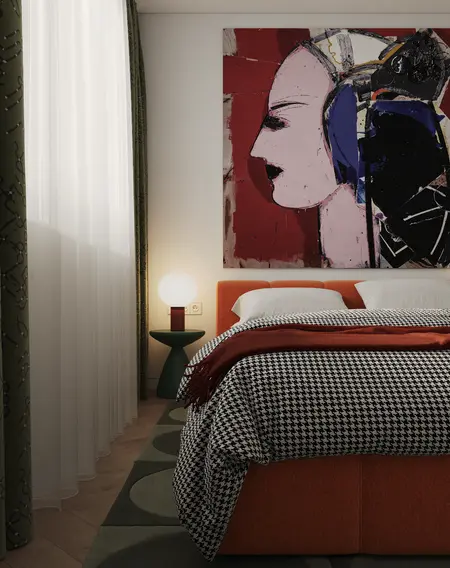 Sypialnia z art deco i vintage, z pomarańczowym łóżkiem i nowoczesnym obrazem.