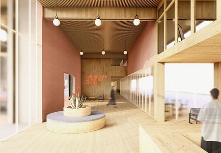 Wnętrze centrum sportowego w stylu industrialnym i skandynawskim z drewnianymi elementami.