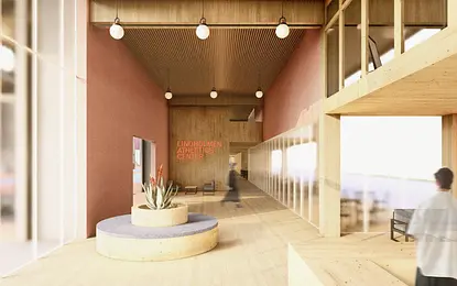 Wnętrze centrum sportowego w stylu industrialnym i skandynawskim z drewnianymi elementami.