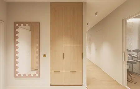 Minimalistyczny przedpokój w stylu japandi z drewnianą szafą i lustrem.