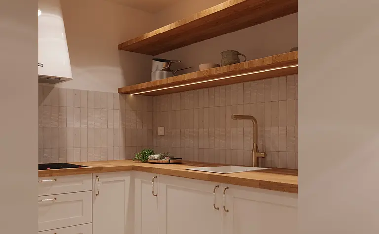Minimalistyczna kuchnia z białymi meblami i drewnianymi akcentami.
