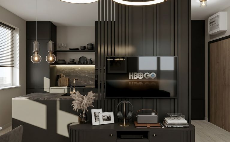 Wnętrze salonu z czarnymi akcentami i nowoczesnym oświetleniem, styl quiet luxury.