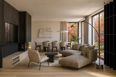 Wnętrze salonu z brązową sofą, jadalnią i nowoczesnymi akcentami.