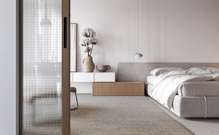 Wnętrze sypialni w stylu boho, japandi i minimalistycznym z białym łóżkiem.