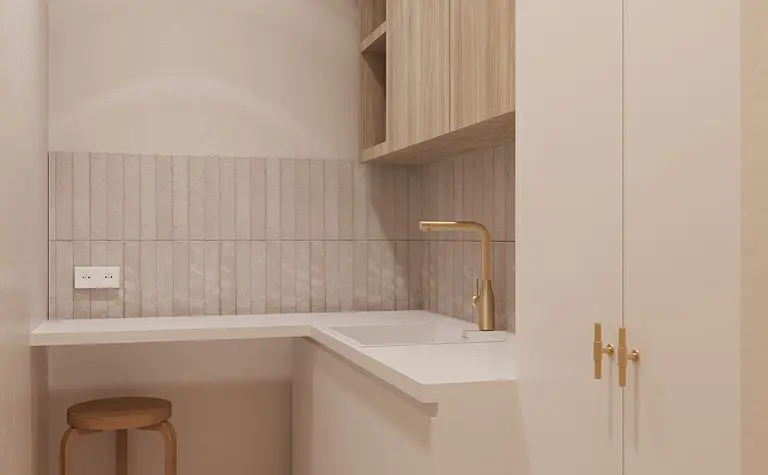 Minimalistyczne wnętrze kuchni z białym blatem i drewnianymi akcentami.