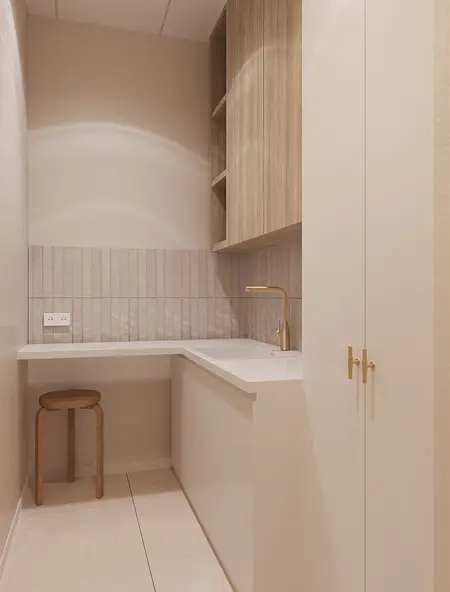 Minimalistyczne wnętrze kuchni z białym blatem i drewnianymi akcentami.
