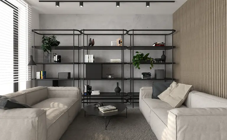 Wnętrze salonu w stylu industrialnym i minimalistycznym z szarymi ścianami i jasnymi meblami.