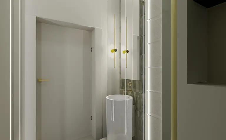 Wnętrze łazienki z białą umywalką, złotymi detalami i minimalistycznym designem.