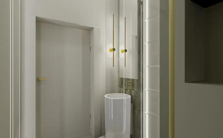 Wnętrze łazienki z białą umywalką, złotymi detalami i minimalistycznym designem.