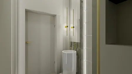 Wnętrze łazienki z białą umywalką, złotymi detalami i minimalistycznym designem.