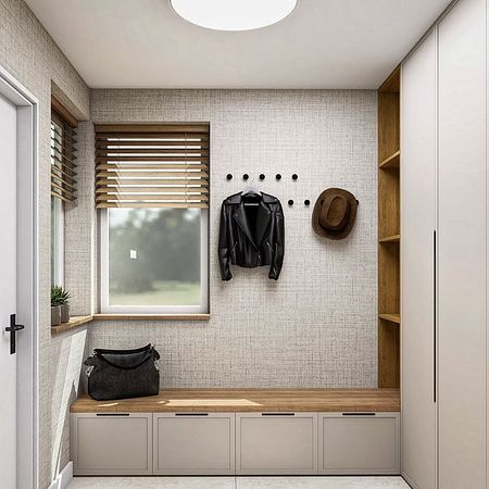 Przedpokój w stylu minimalistycznym z szafą i drewnianymi detalami.