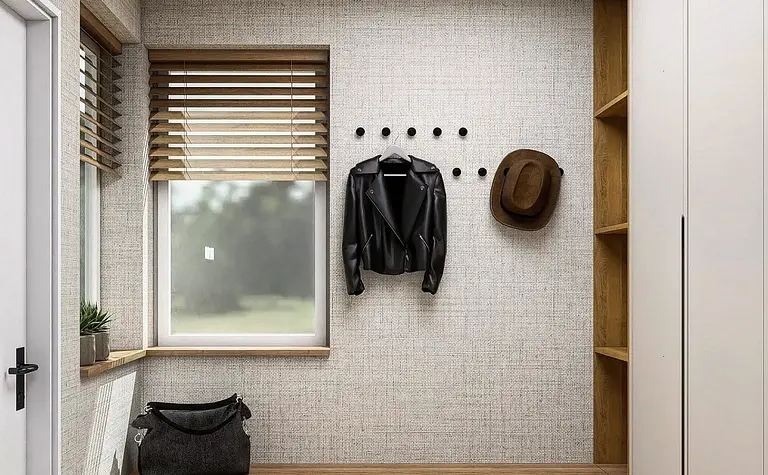 Przedpokój w stylu minimalistycznym z szafą i drewnianymi detalami.