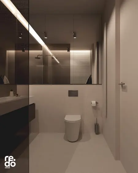 Nowoczesna łazienka w minimalistycznym stylu z białą toaletą i szarymi detalami.