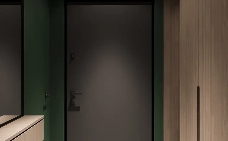 Stylowy przedpokój z zielonymi ścianami i białą podłogą w minimalistycznym i nowoczesnym stylu.