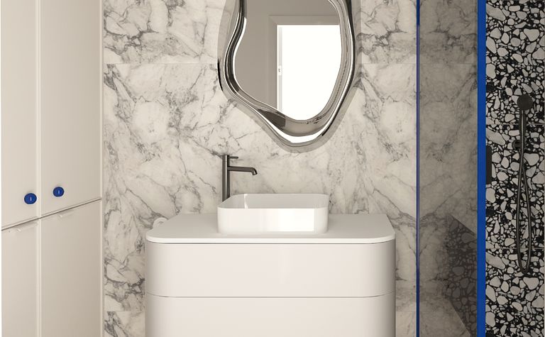 Nowoczesna łazienka z marmurowymi ścianami i elegancką umywalką