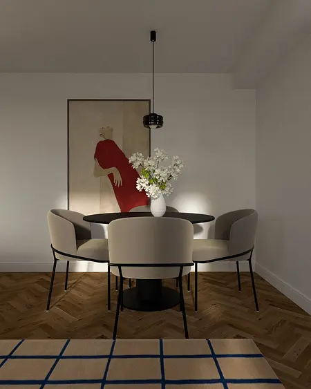 Eklektyczna jadalnia z okrągłym stołem, krzesłami i wazonem z kwiatami.