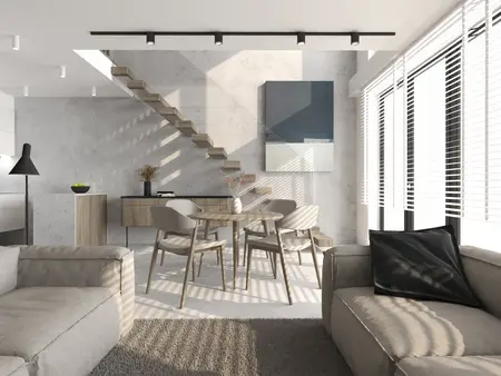 Wnętrze w stylu industrialnym z minimalistycznymi meblami i jasnymi ścianami.